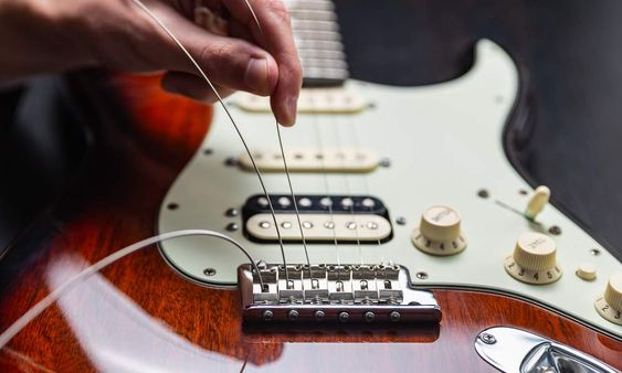 setting up guitar string