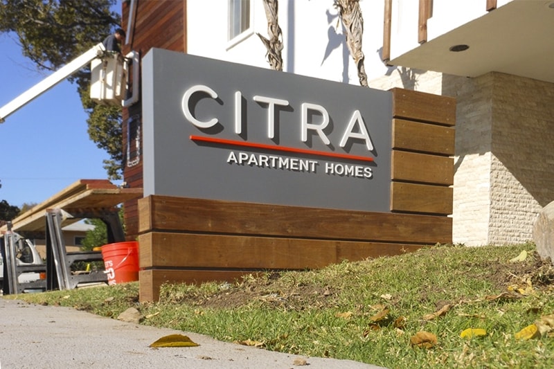 Citra Apartment Homes custom monument sign with wireway mounted channel letters in Burbank, California.