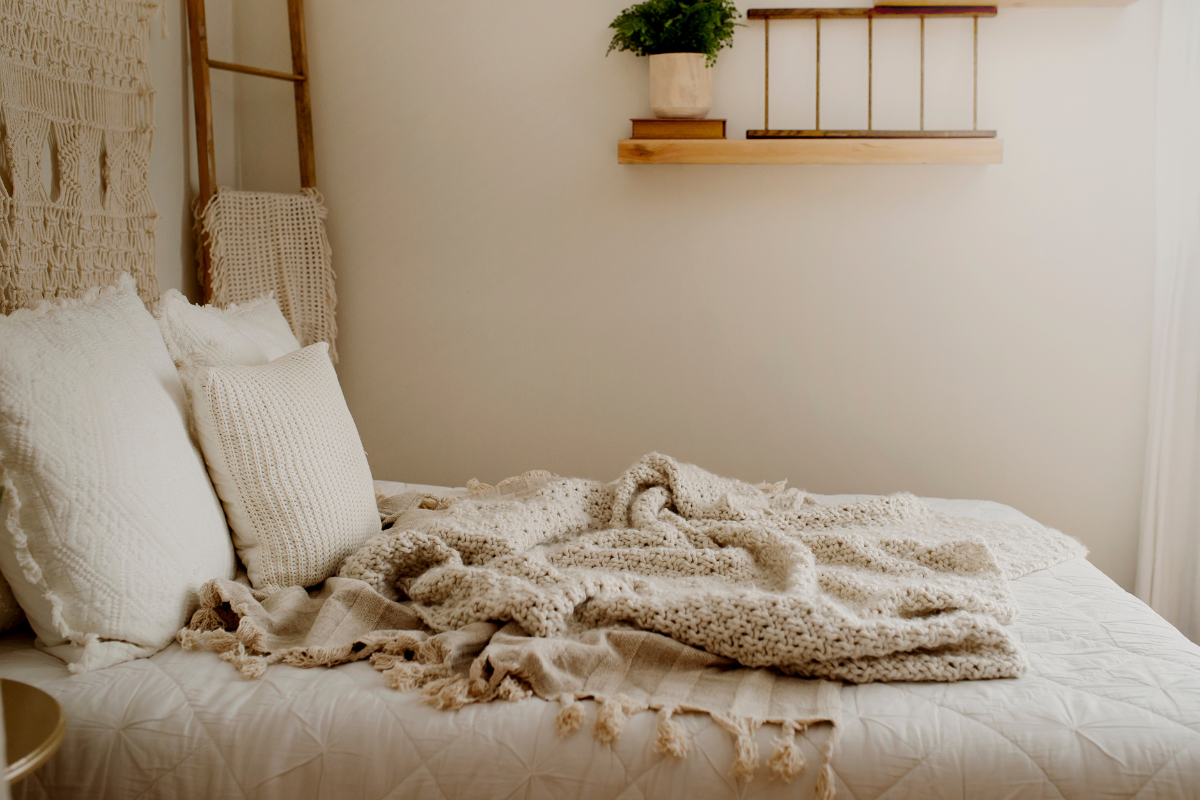 A cozy throw blanket draped over a couch