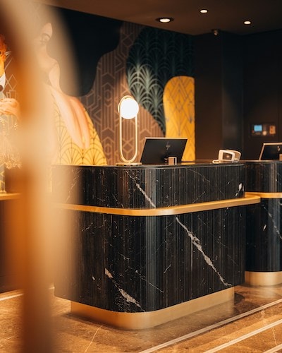The front desk of a cool hotel, where you can get settled and take advantage of the top-rate service here
