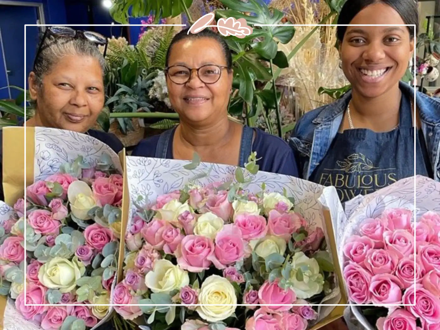 Three women smiling with pink and white rose bouquets - Fabulous Flowers and Gifts