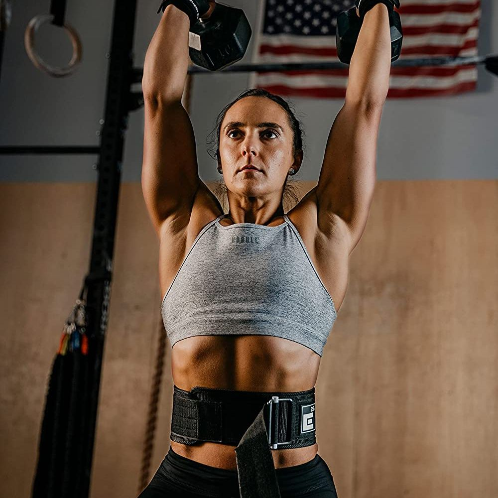 Weightlifter wearing a weightlifting belt and demonstrating proper form