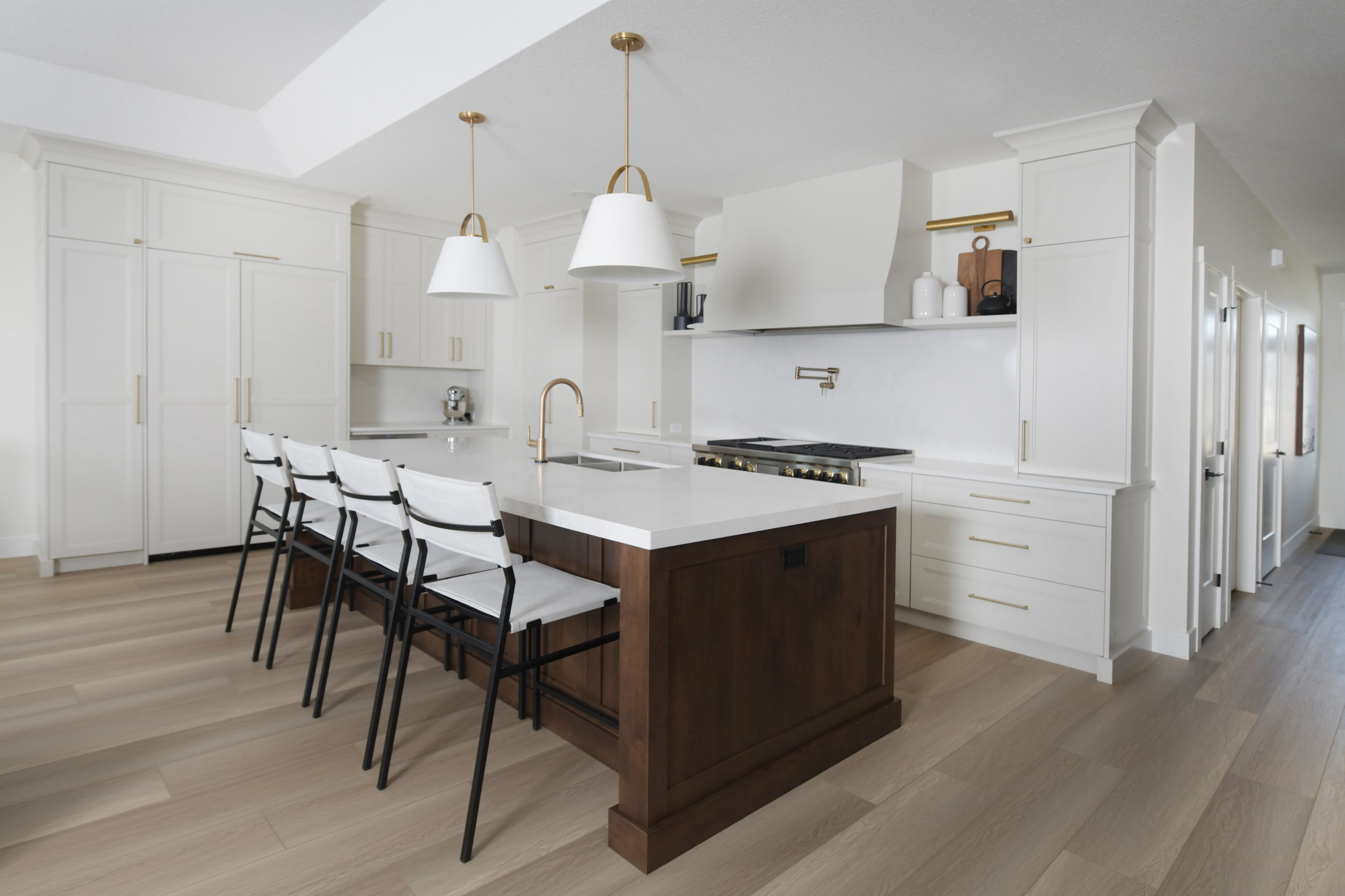 white kitchen with wood island 2024 kitchen trend