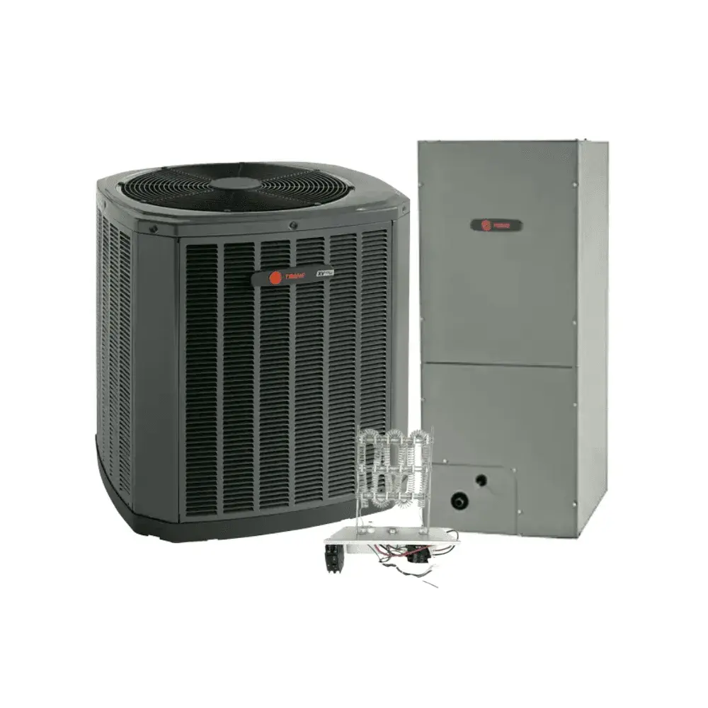 Close-up of a modern Trane heat pump outdoor unit on a concrete pad, surrounded by green landscaping, exemplifying advanced heat pump technology for efficient heating and cooling.