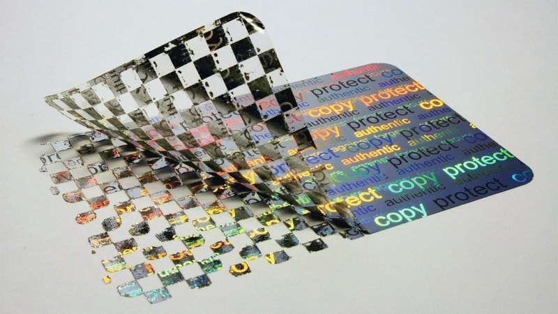 Holographic sticker peeled off, showing checkerboard pattern