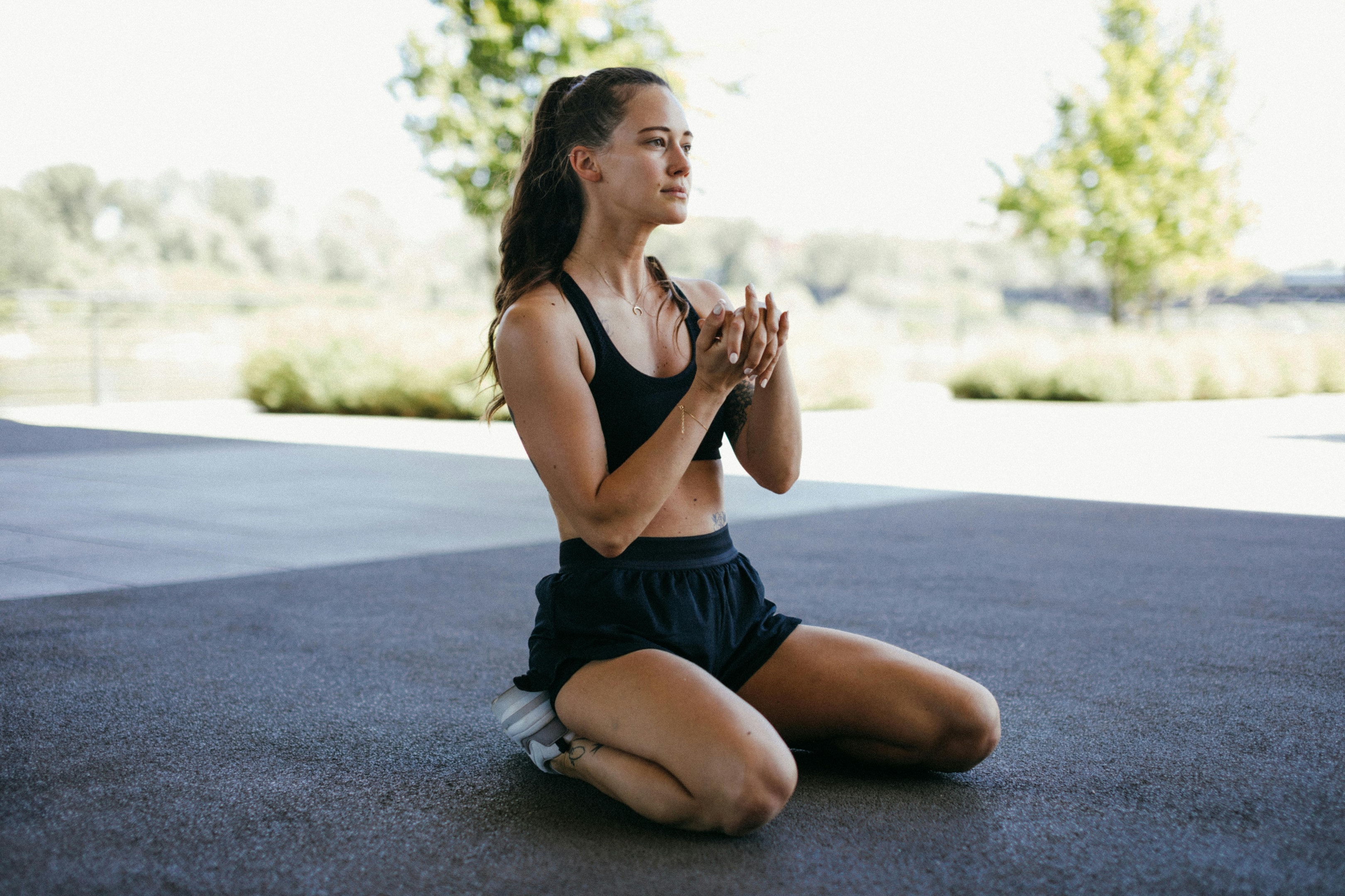 Photo by KoolShooters  : https://www.pexels.com/photo/a-woman-doing-stretching-while-kneeling-8520557/