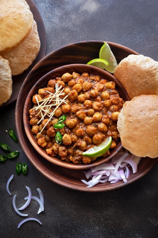 Chole Bhature: Traditional Indian dish with spicy chickpea curry and fluffy fried bread.