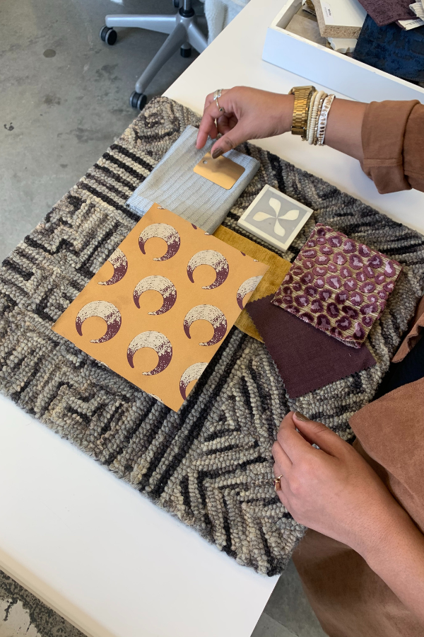 a designer crafts a mood board with tonal shades