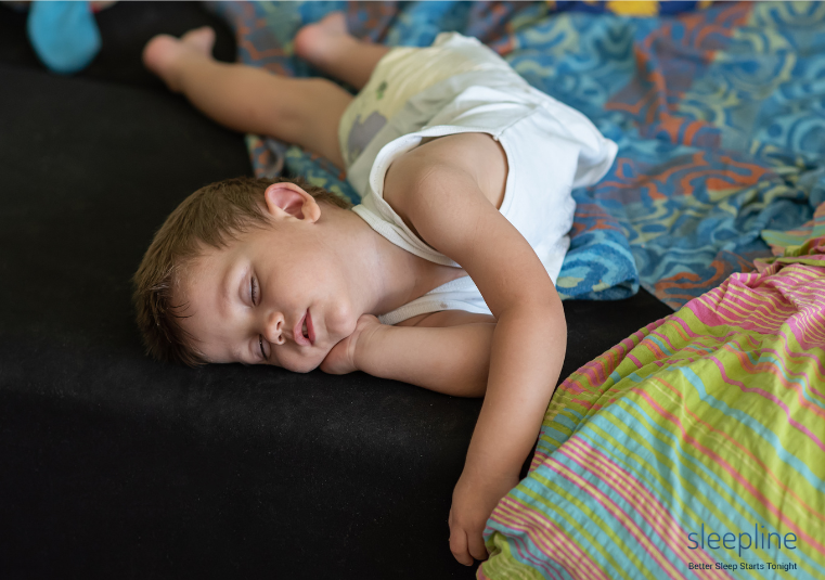 Kid sleeping without a pillow, causing unnatural spinal alignment