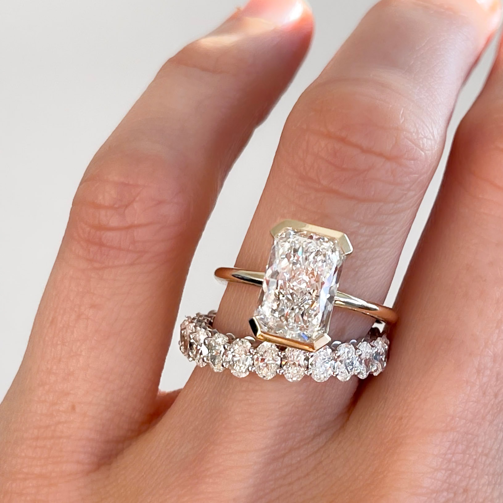 North South Half Bezel Solitaire Engagement Ring With Elongated Radiant Cut Diamond