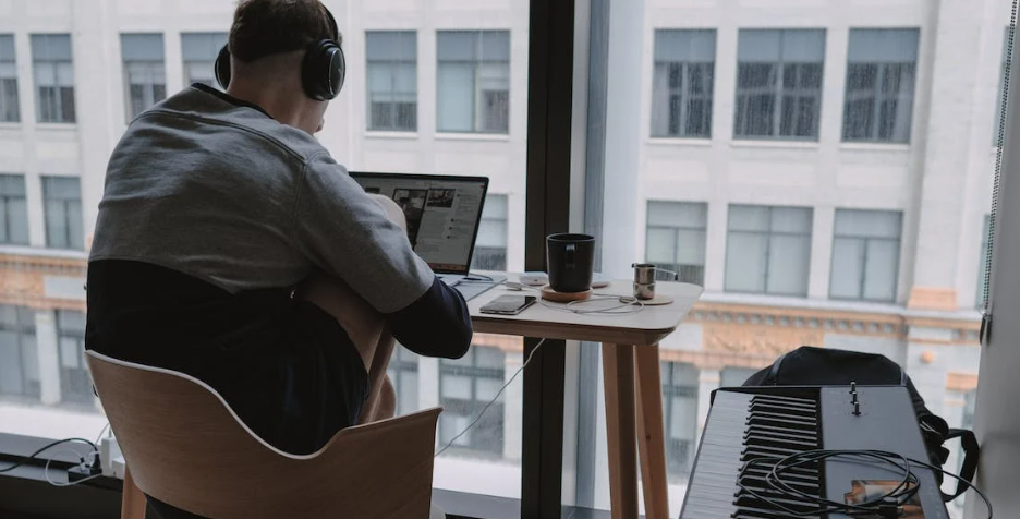 Man Sitting at Home on His Laptop