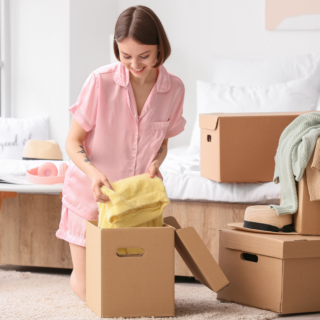woman packing up her bedroom