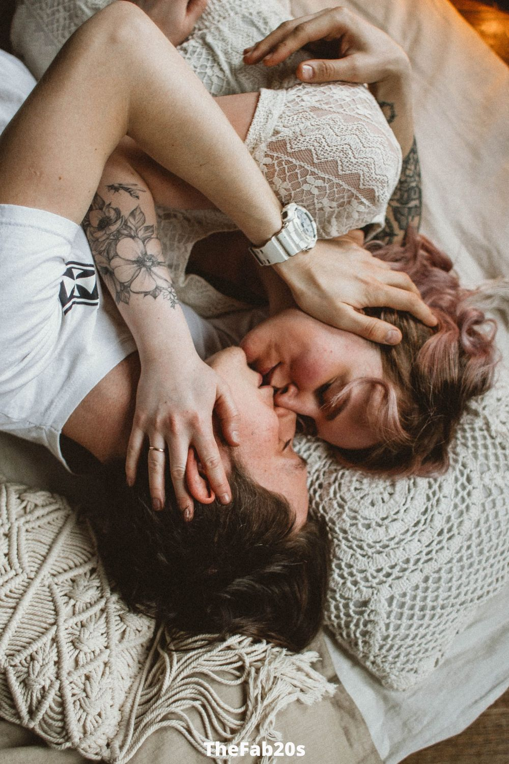 Man and woman, kissing in bed - Featured in Signs He Regrets Sleeping With You