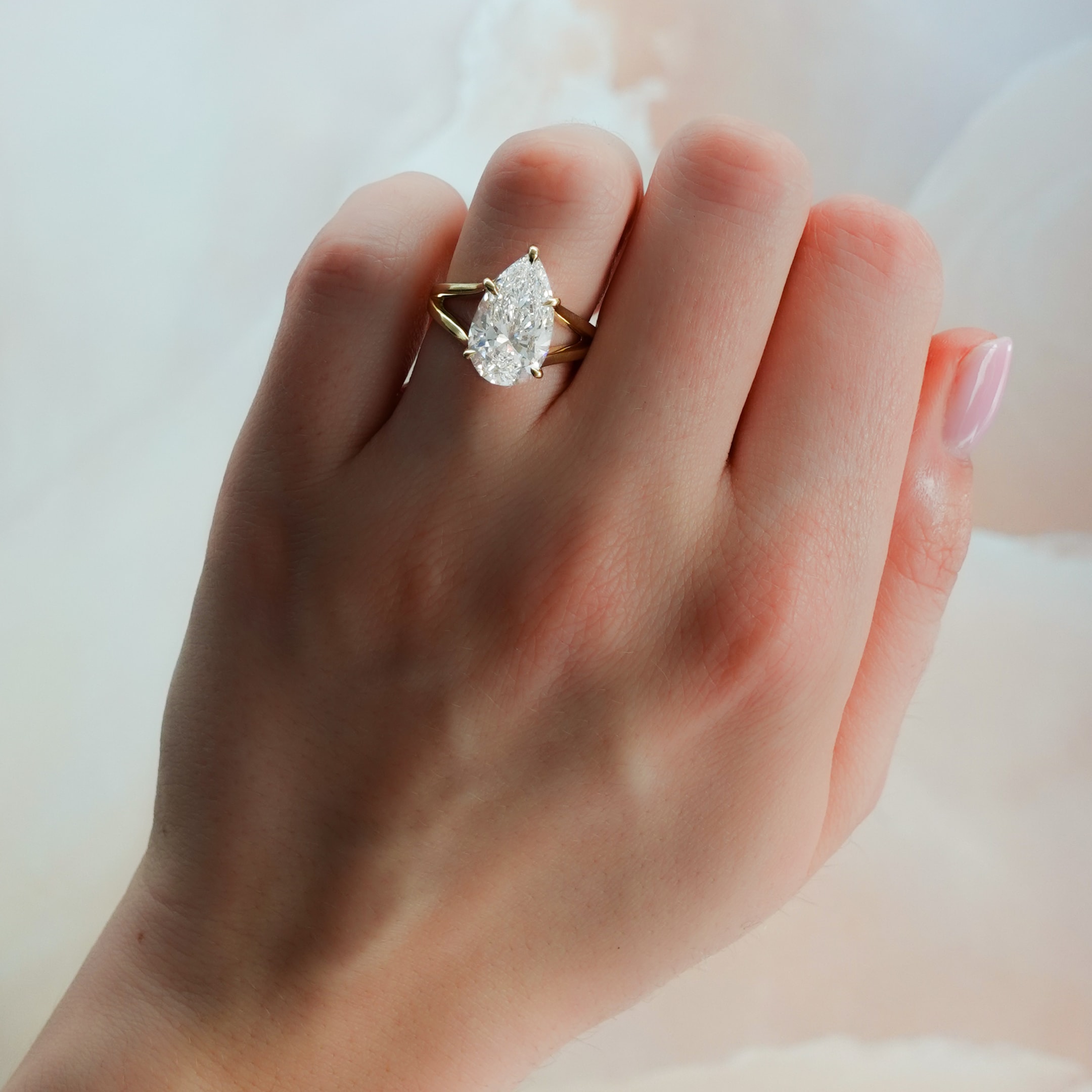 split shank solitaire with a pear cut diamond