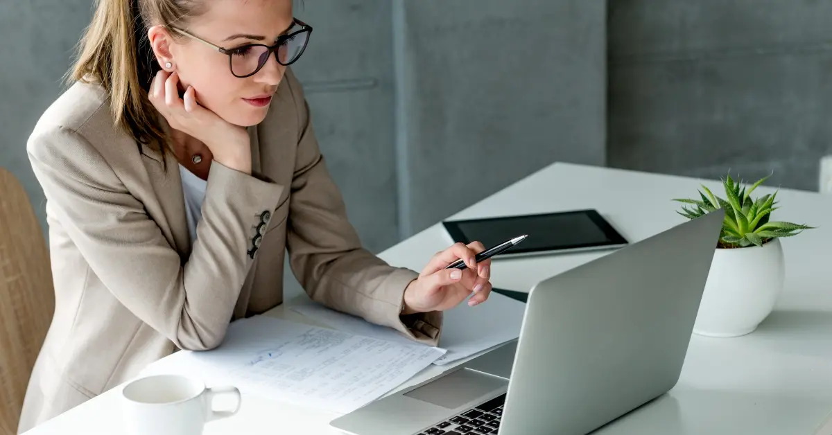 Woman brainstorming and choosing a legal business name for her OnlyFans account.