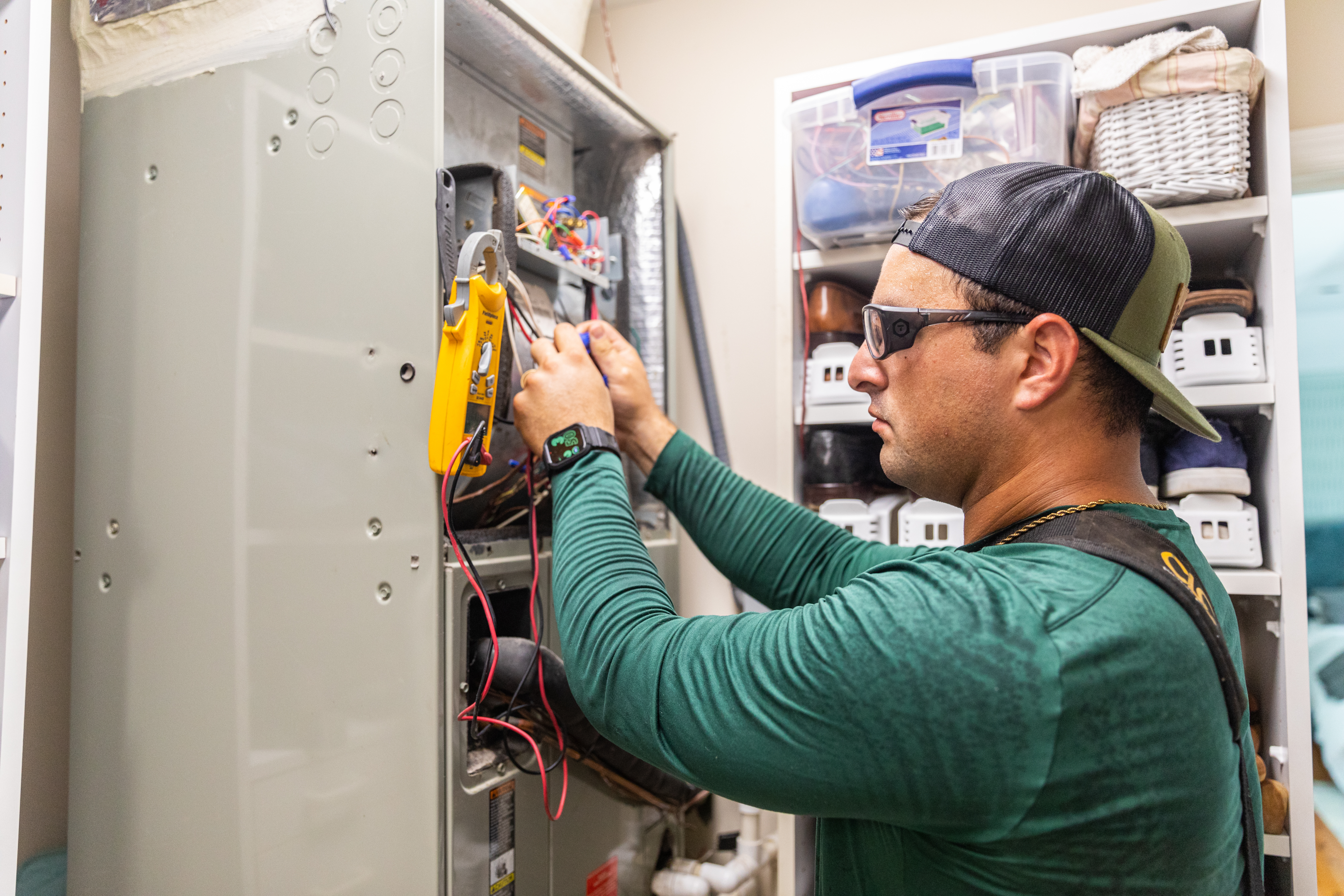 Professional technician inspecting an air conditioning unit