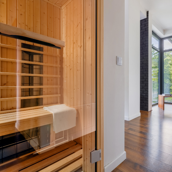 Image of an amazing custom-built outdoor sauna with glass sauna door.