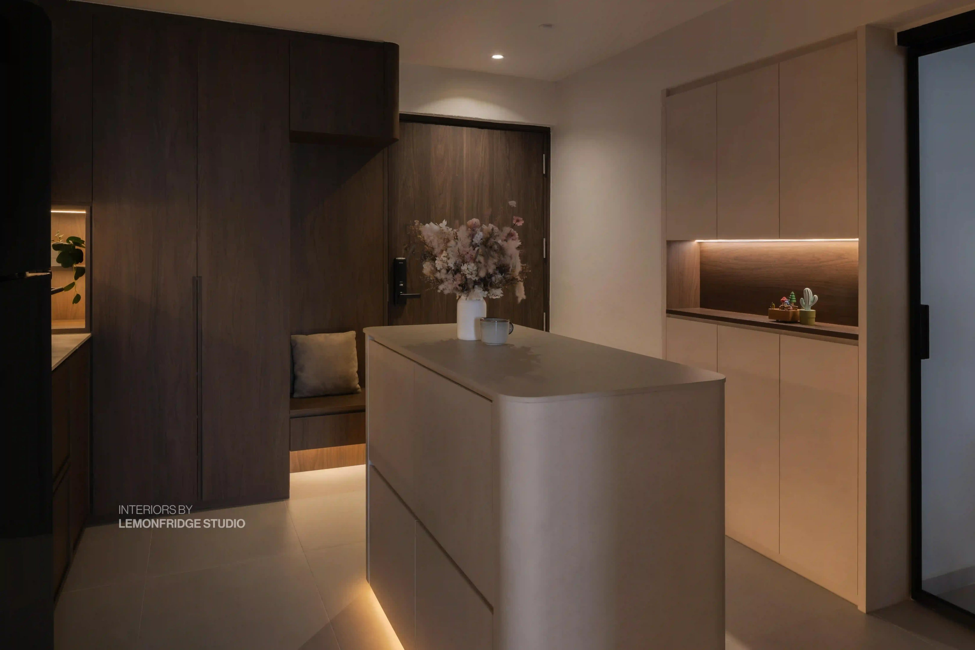 Minimalist smart home entryway in Singapore with digital door lock, concealed storage and sensor-activated cove lighting