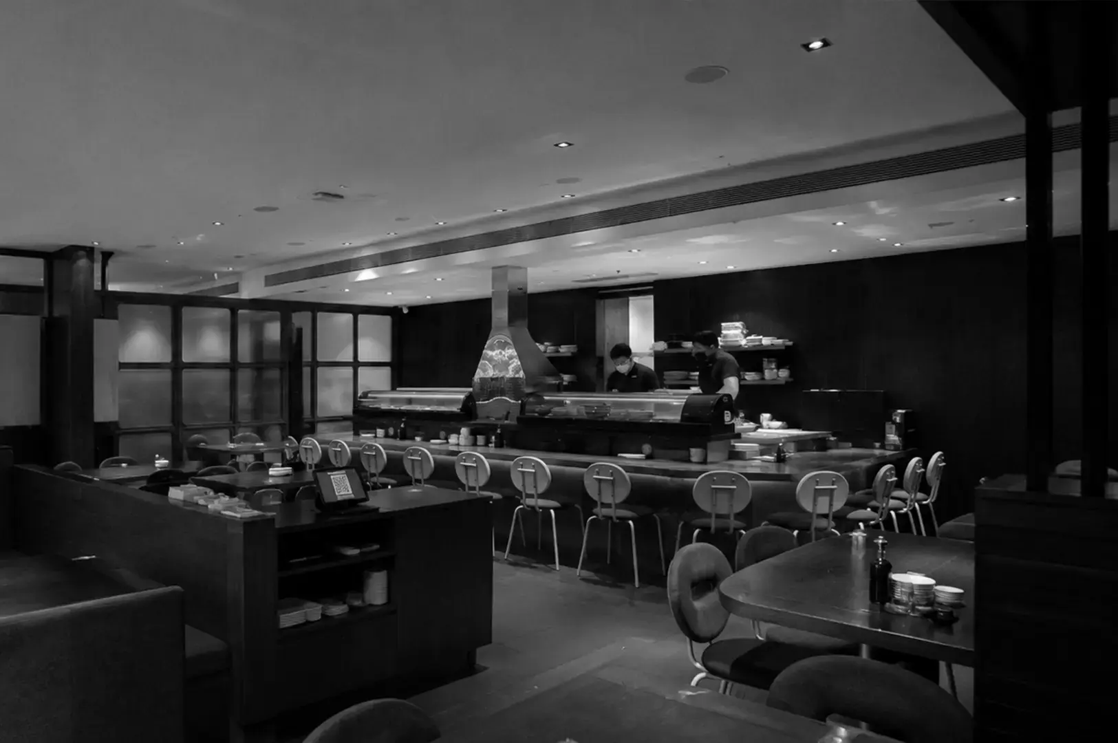 Stylish interior of Standing Sushi Bar at Odeon Towers with sushi counter seating and contemporary Japanese décor.