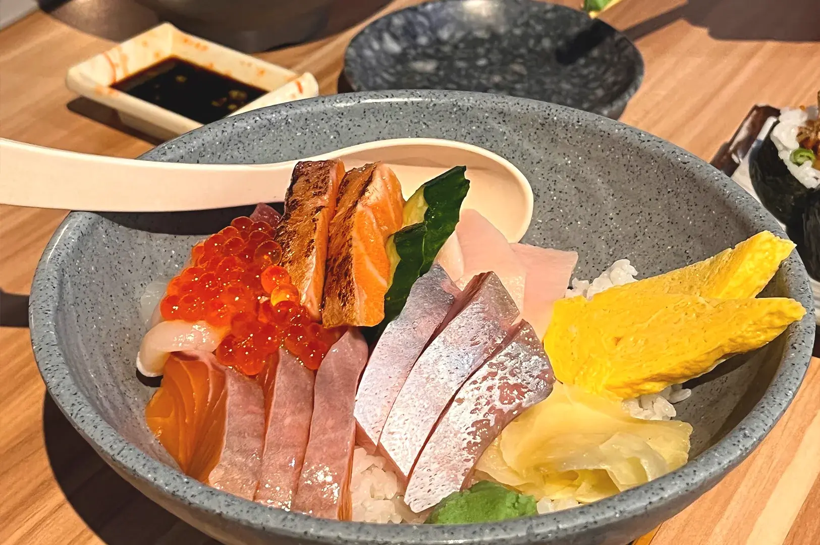 The famous Kaisen Chirashi Don at The Sushi Bar, Ngee Ann City, topped with a variety of thick-cut sashimi and fresh garnishes.