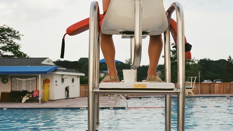 Lifeguard with Rescue Tube at Duty