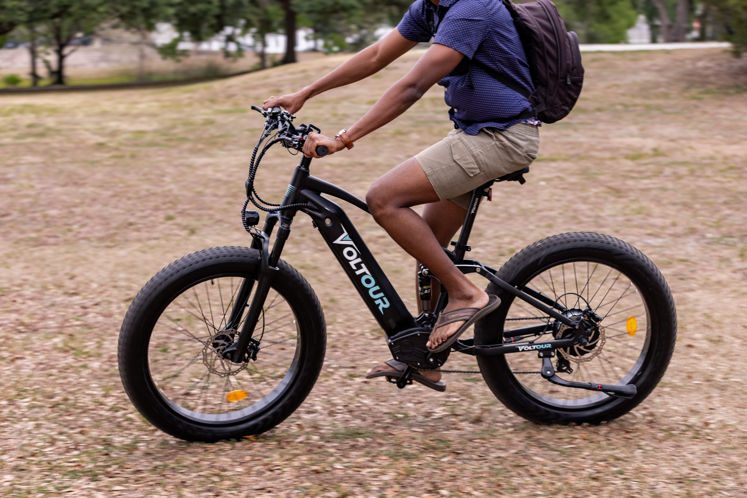 person-riding-electric-mountain-bike