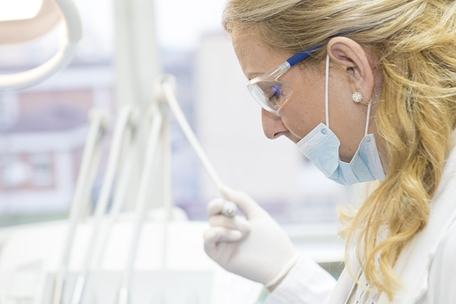 An image of a female doctor preparing to examine a patient.