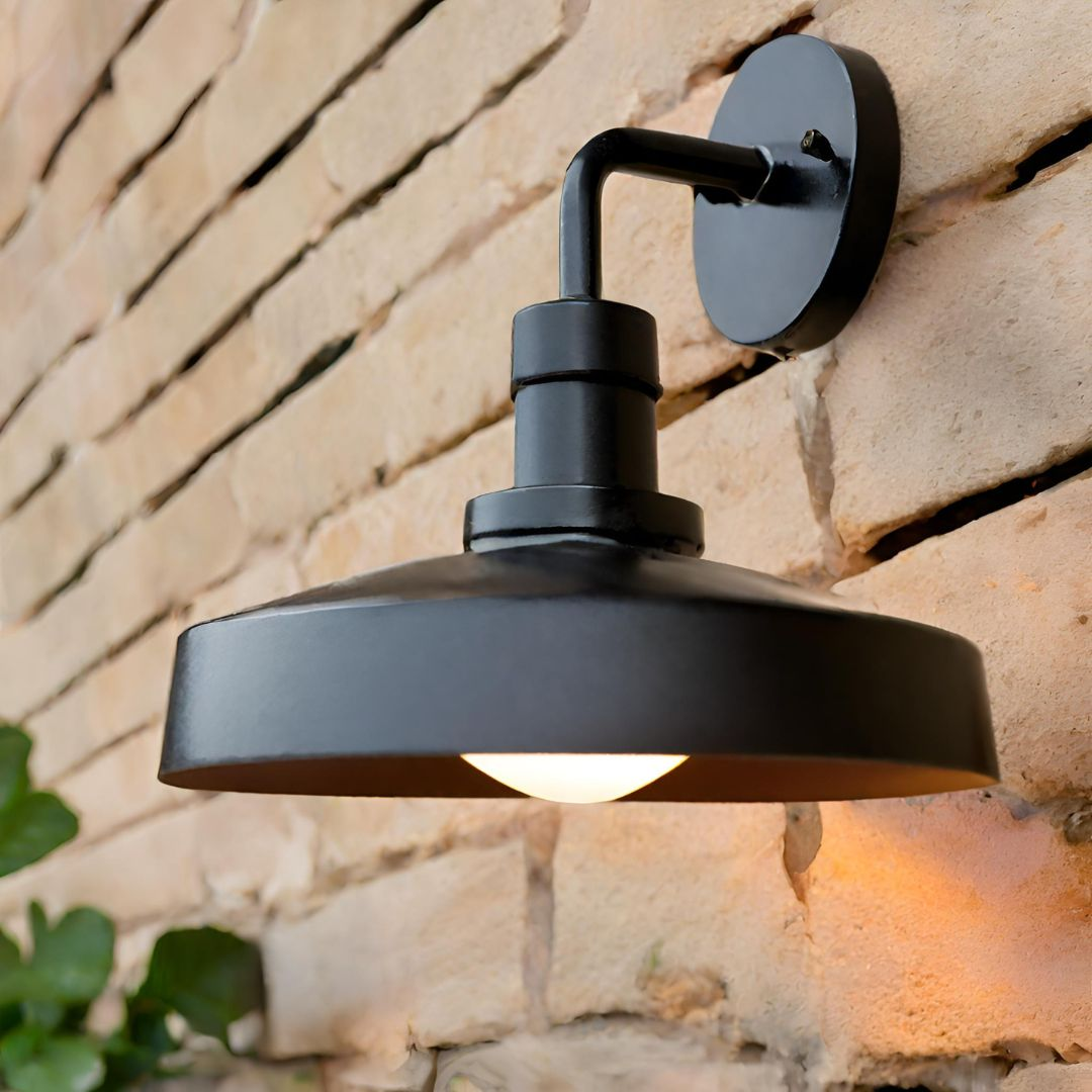 A cantilever shaped vintage wall light mounted on a wall.