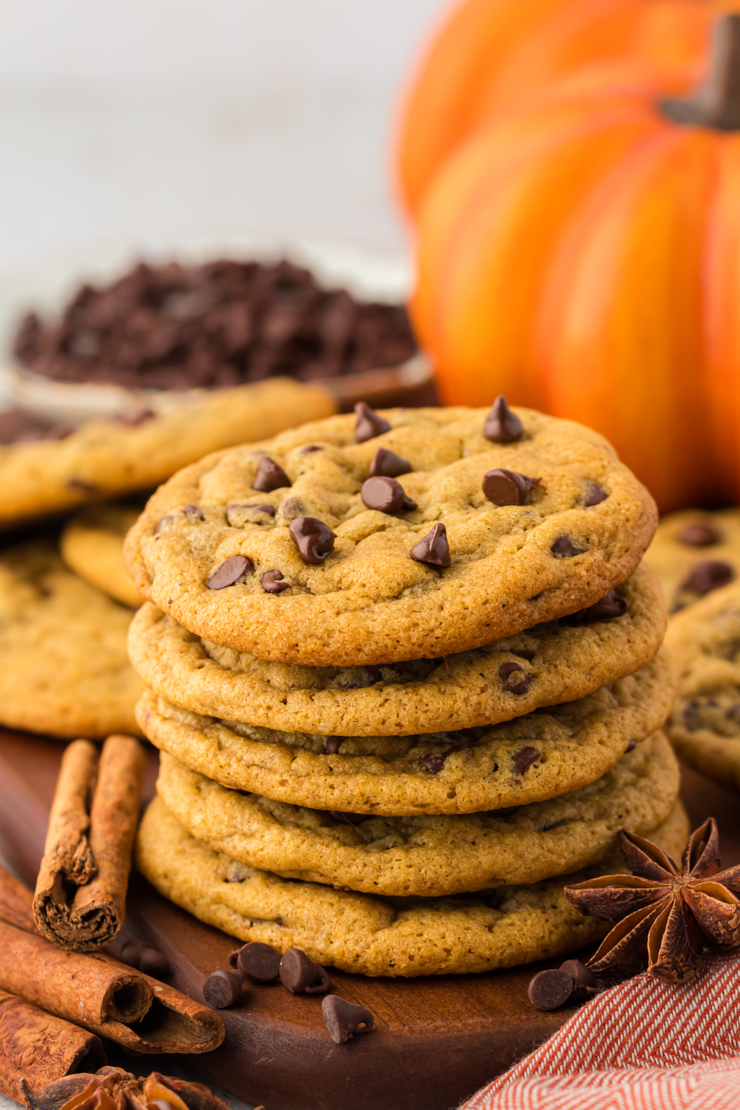 stack of pumpkin cookies made with chocolate chips