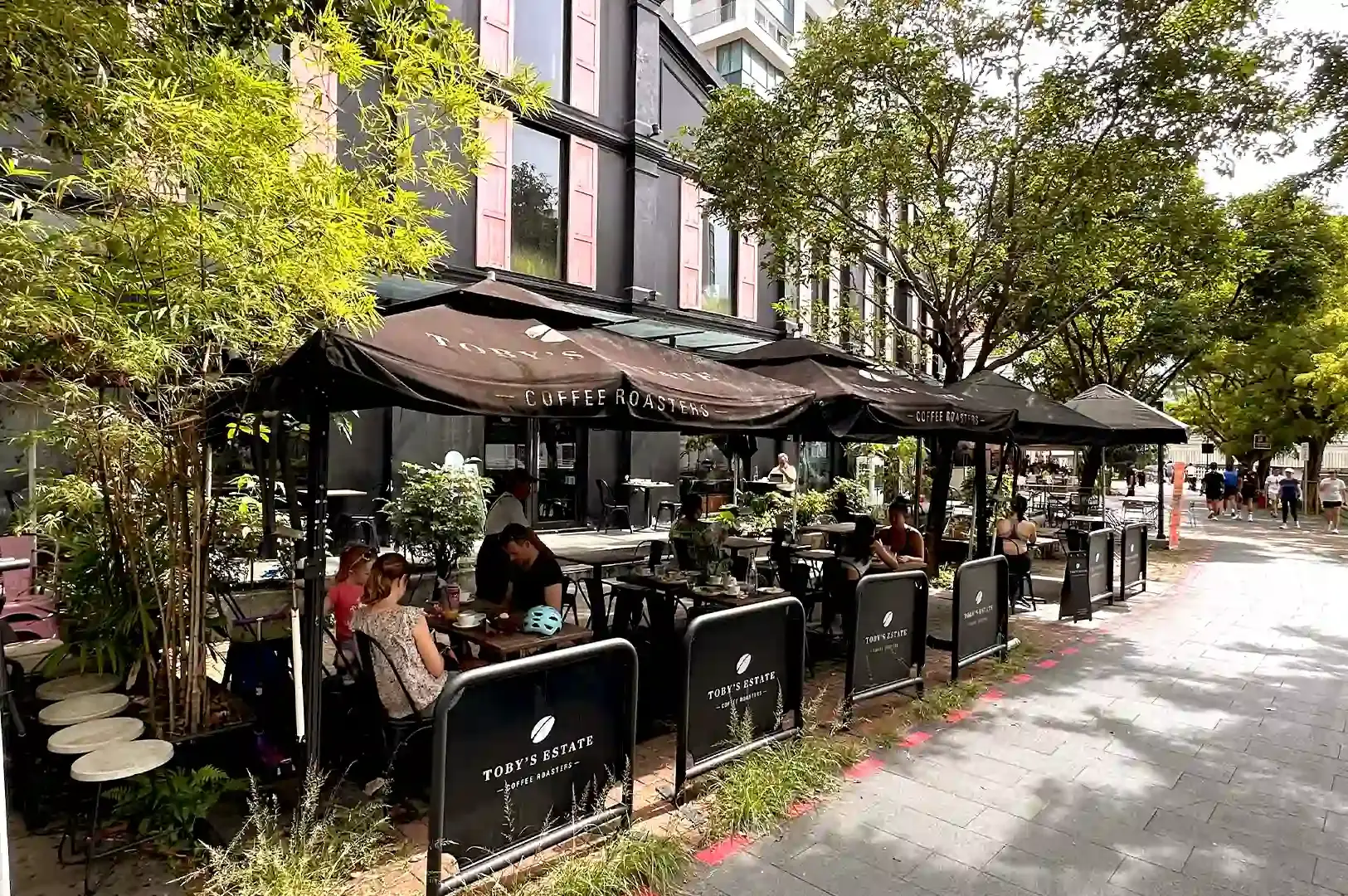 The breezy al fresco dining area of Toby's Estate Coffee Roasters located along the scenic Robertson Quay promenade in Singapore.