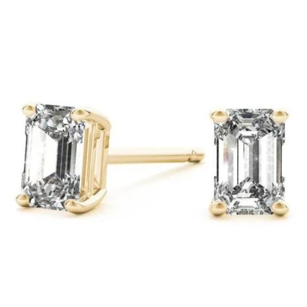 Yellow gold emerald diamond stud earrings.