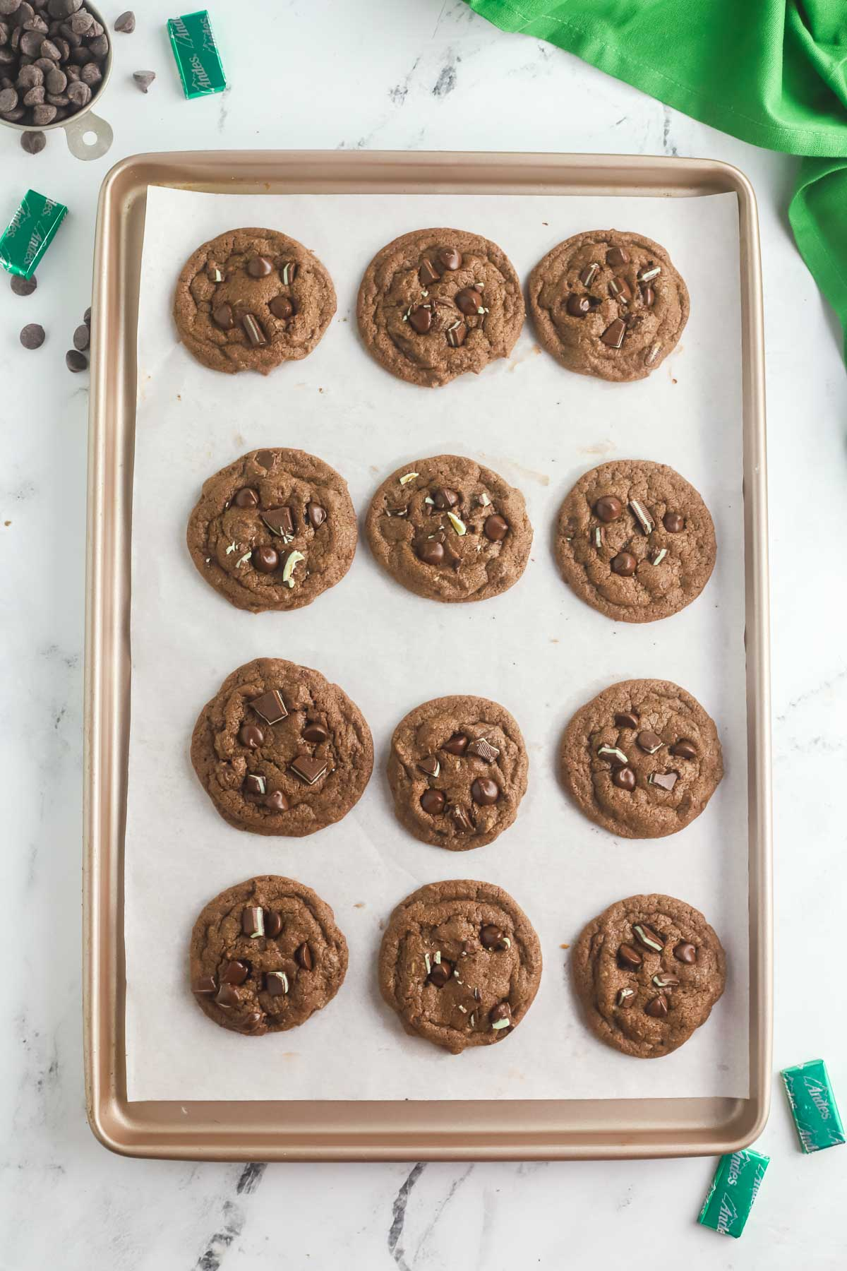 baked Andes mint cookies on parchment lined baking sheet