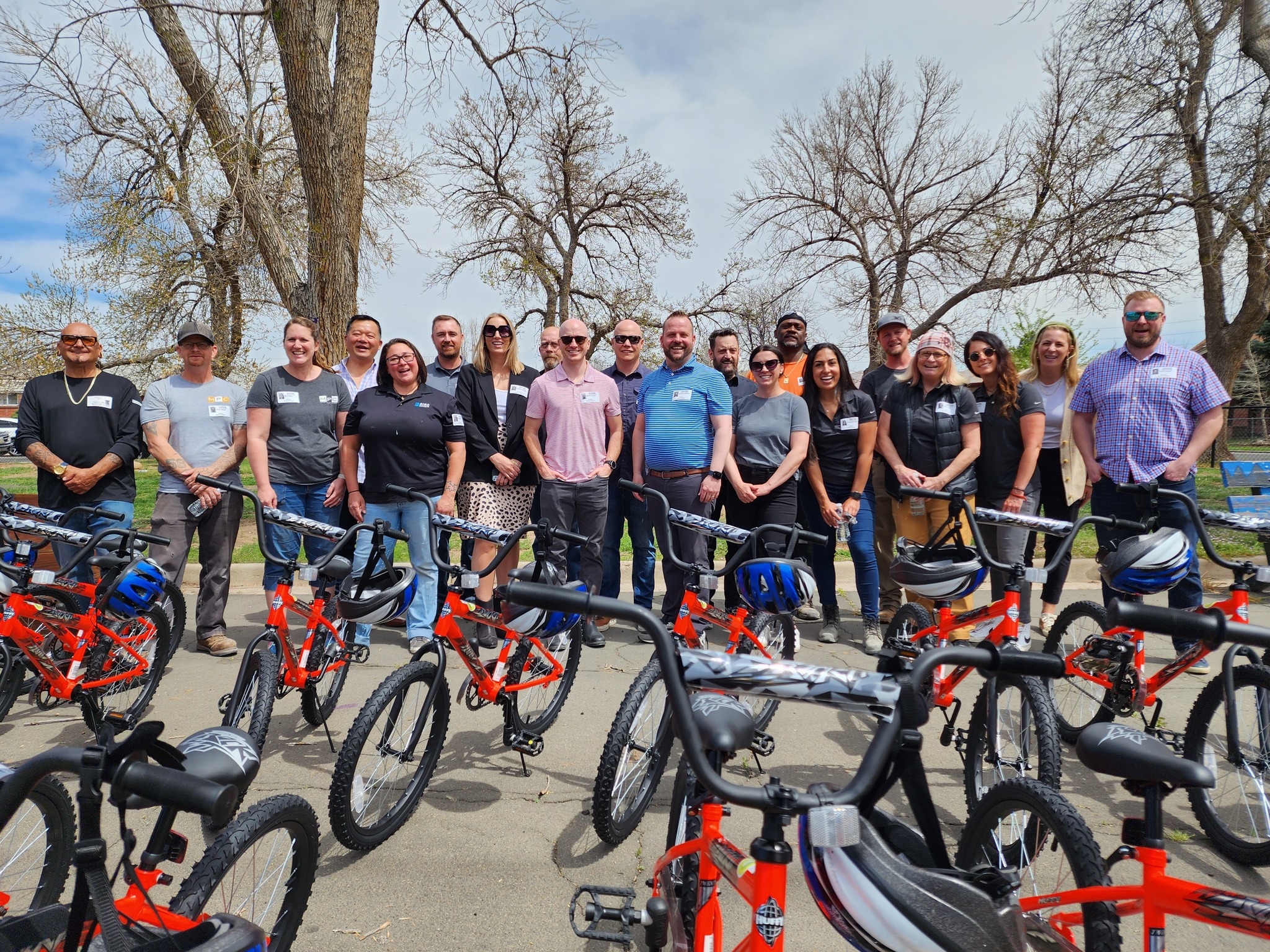 A group posed behind several bikes they built with Wish for Wheels 