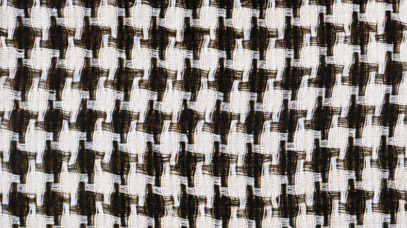 A close-up shot of a black and white patterned houndstooth fabric
