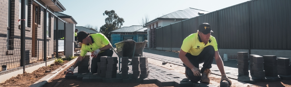 A paving contractor installing a new driveway