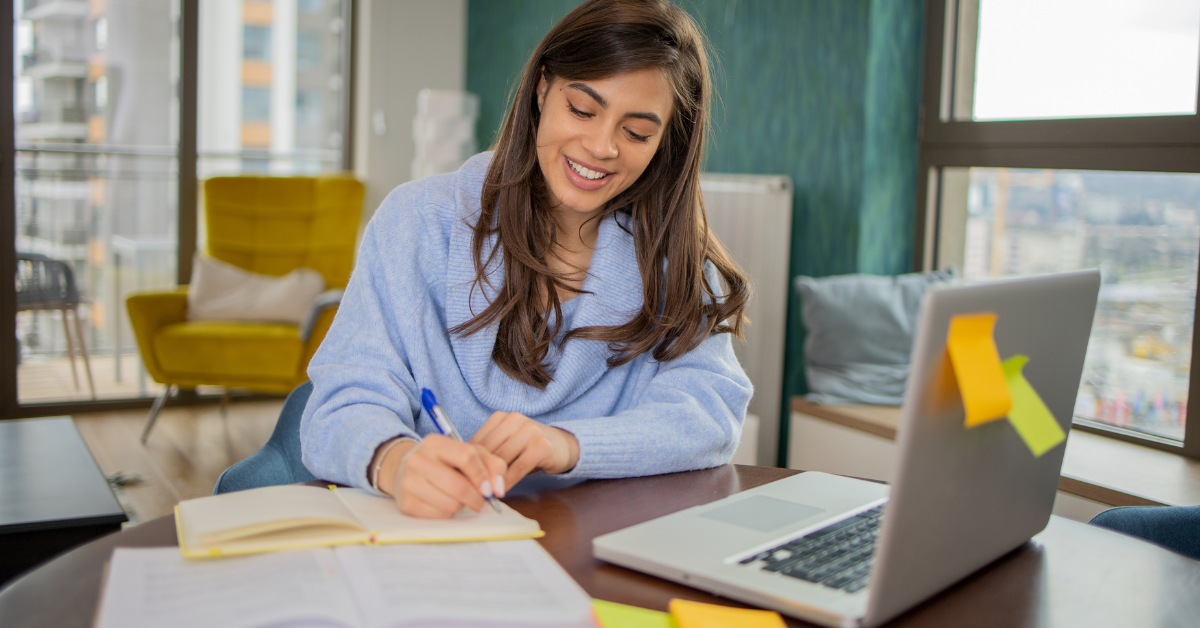 An OnlyFans creator organizing receipts and invoices at her desk while learning what is contract labor on schedule c.