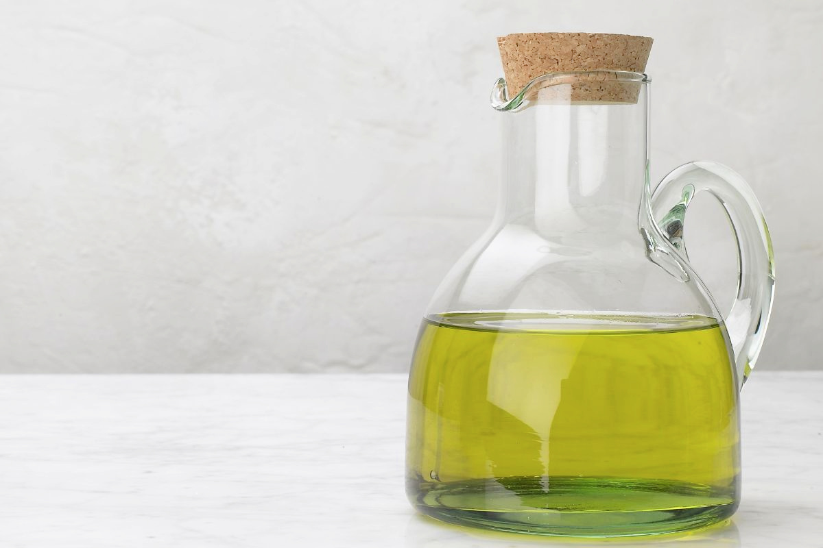 glass container of olive oil