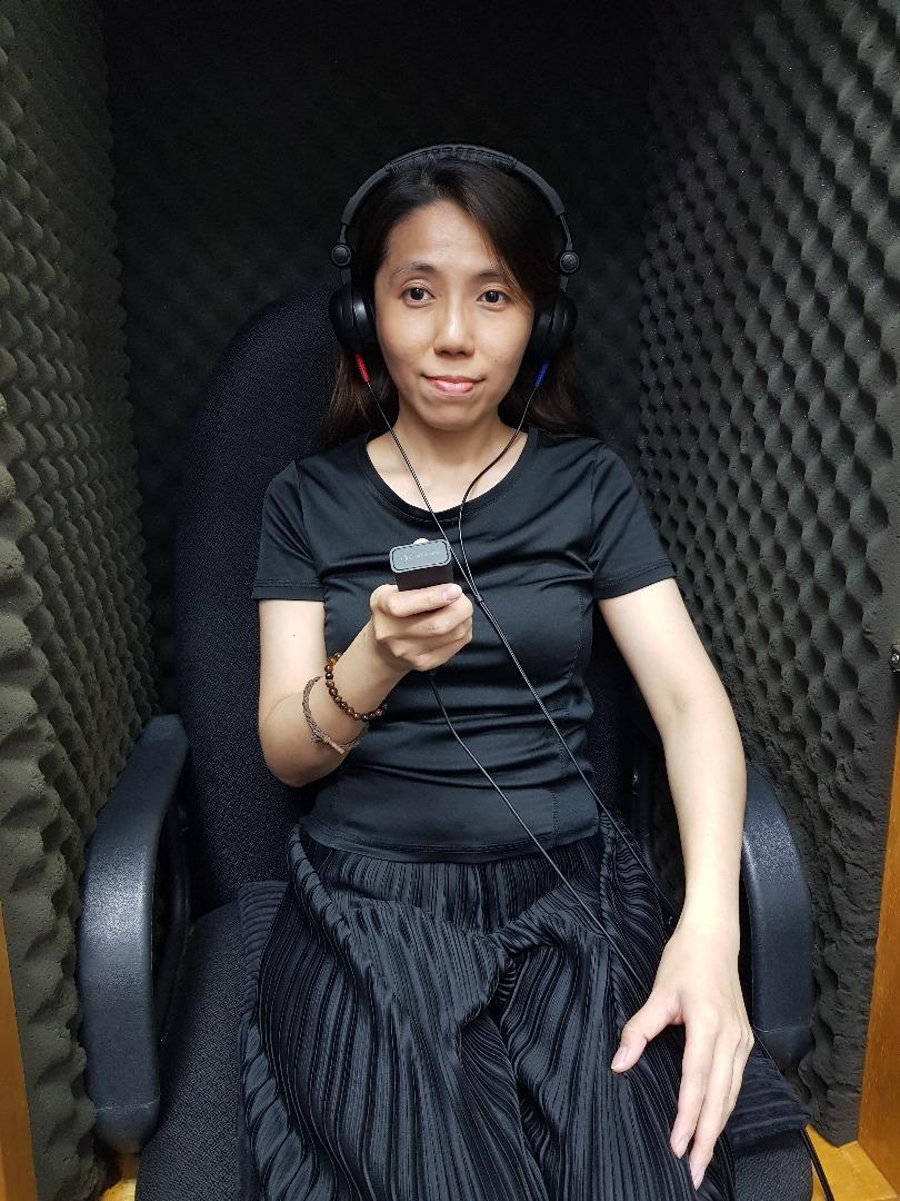 A customer is taking a hearing test inside a sound-proof booth, ensuring an environment free from excessive noise to accurately assess hearing levels. This testing is crucial for identifying potential noise-induced hearing loss and promoting occupational safety in workplaces exposed to high noise levels.