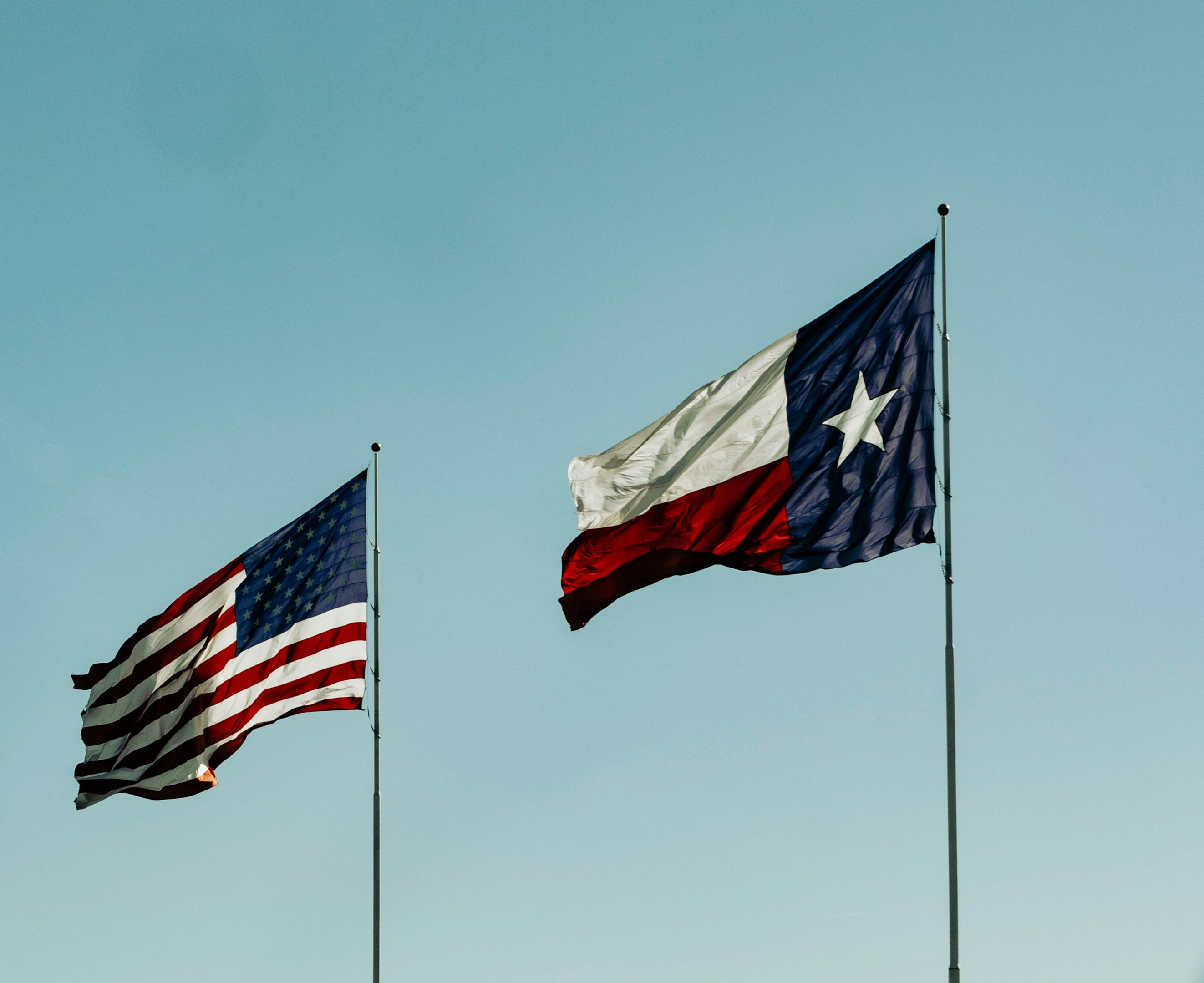 Flag of Texas next to American flag. 