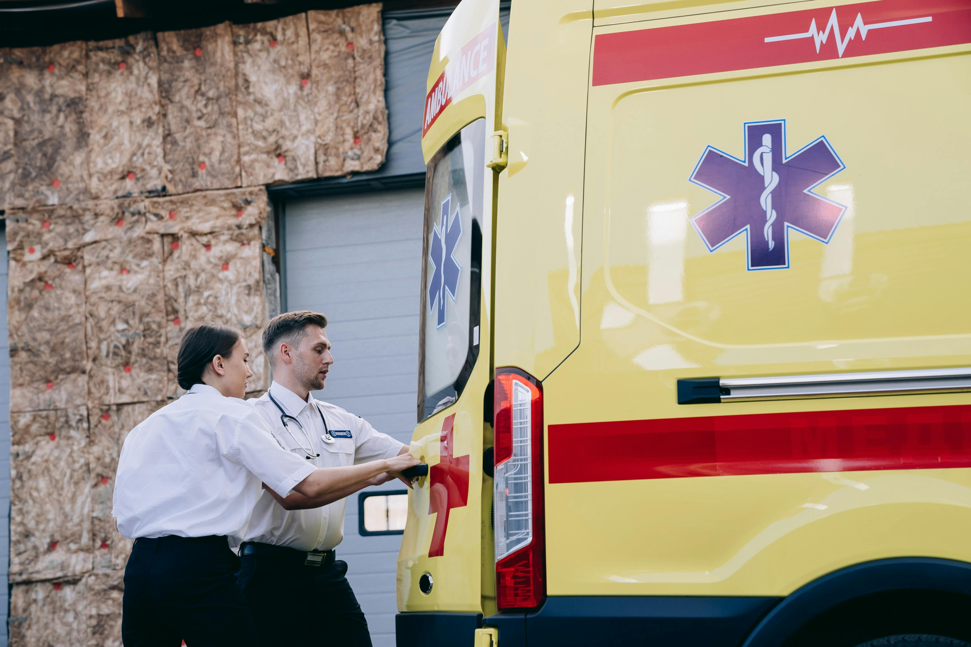 Paramedics entering their emegency response vehicle