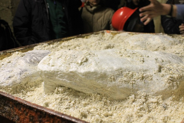 A container of talcum powder with a soft, powdery texture.