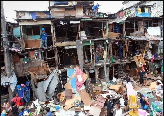 Demolition crews dismantle shanties in the Makati financial district of Manila on Sept. 24, 2012 Francis R. Malasig / EPA https://www.nbcnews.com/news/photo/armed-rocks-bottles-squatters-clash-police-homes-are-demolished-philippines-flna1b6066794