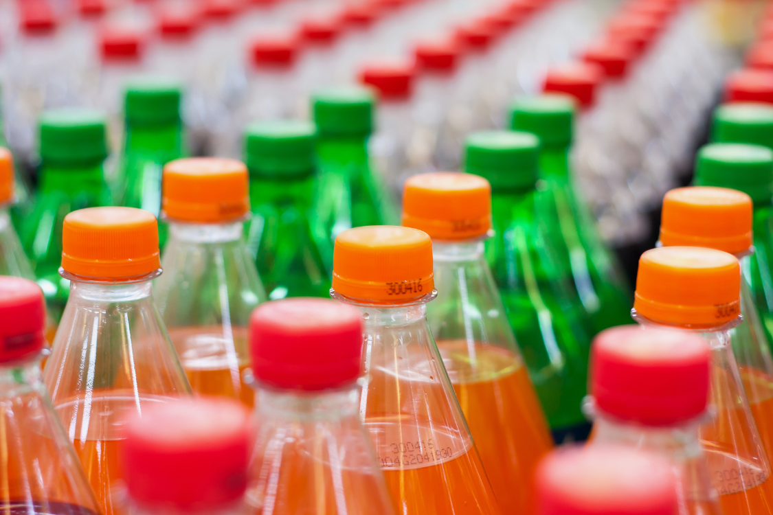 Close-up of caps on functional beverage bottles showing variety and product range