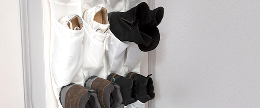 A white fabric over the door shoe holder.