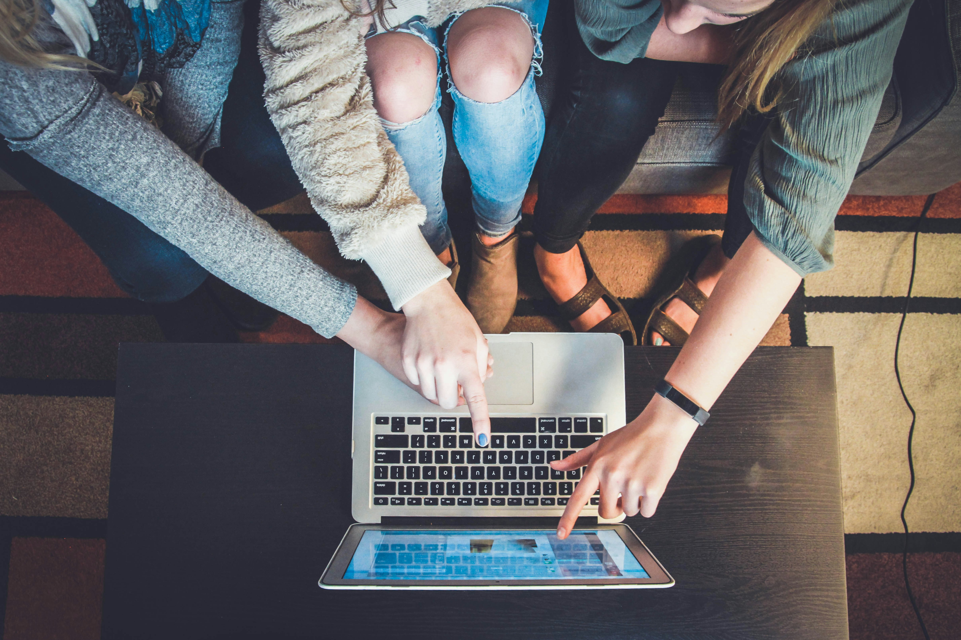 Adult learners in a professional development classroom setting, highlighting the importance of continuous learning and training programs in closing the skills gap.