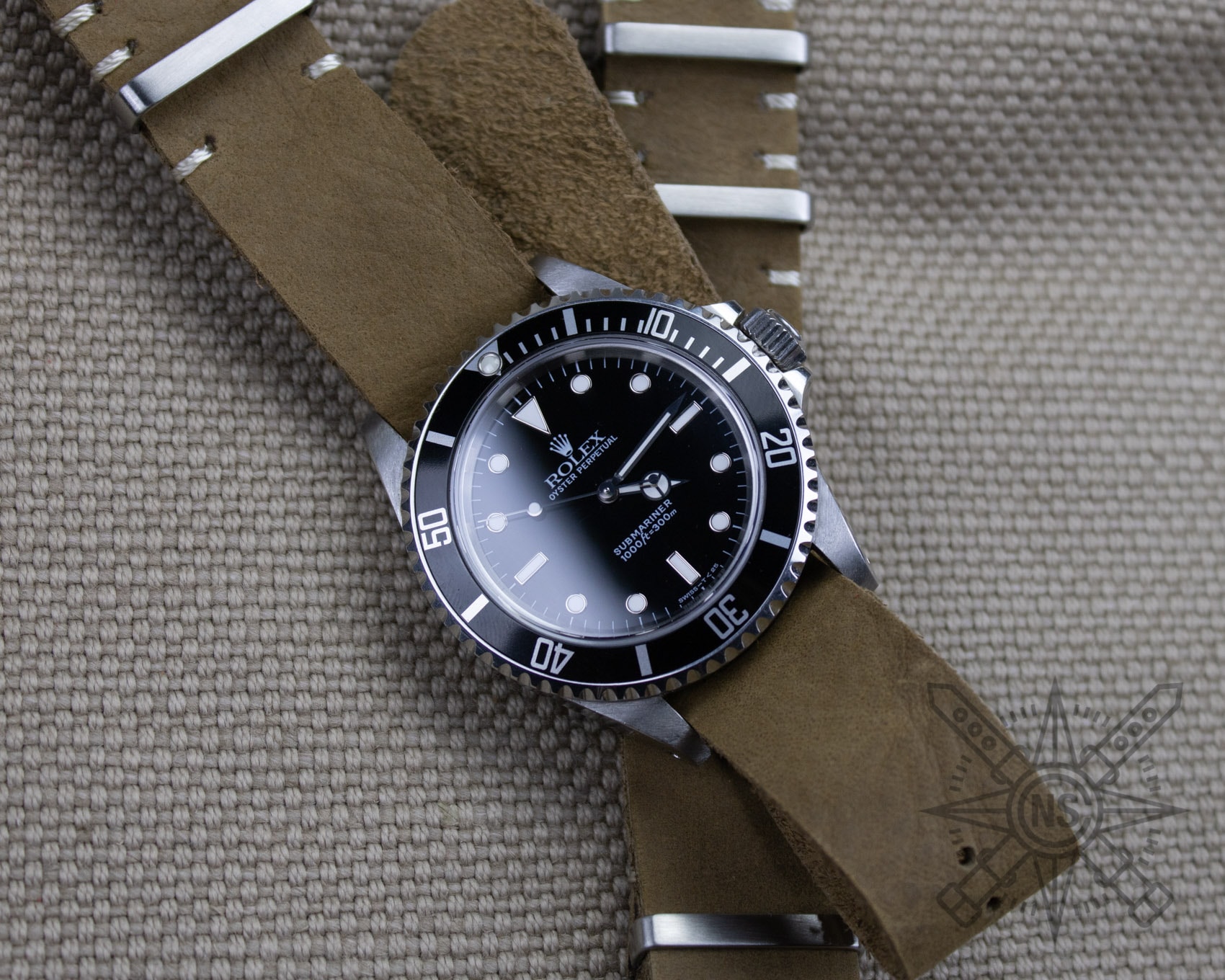 Full-grain leather pieces displayed in a workshop.