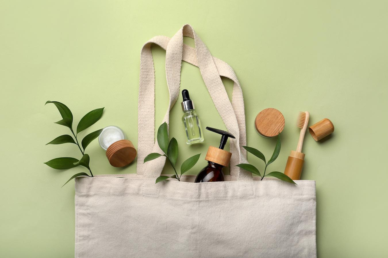a tote bag of natural beauty products travel beauty travel sizes worry long day night lipstick red eyes moisturizer sun hair sleep packing space lipstick flight space carry travel beauty