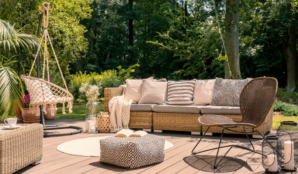 Natural Rattan furniture - large sofa and chairs on garden decking