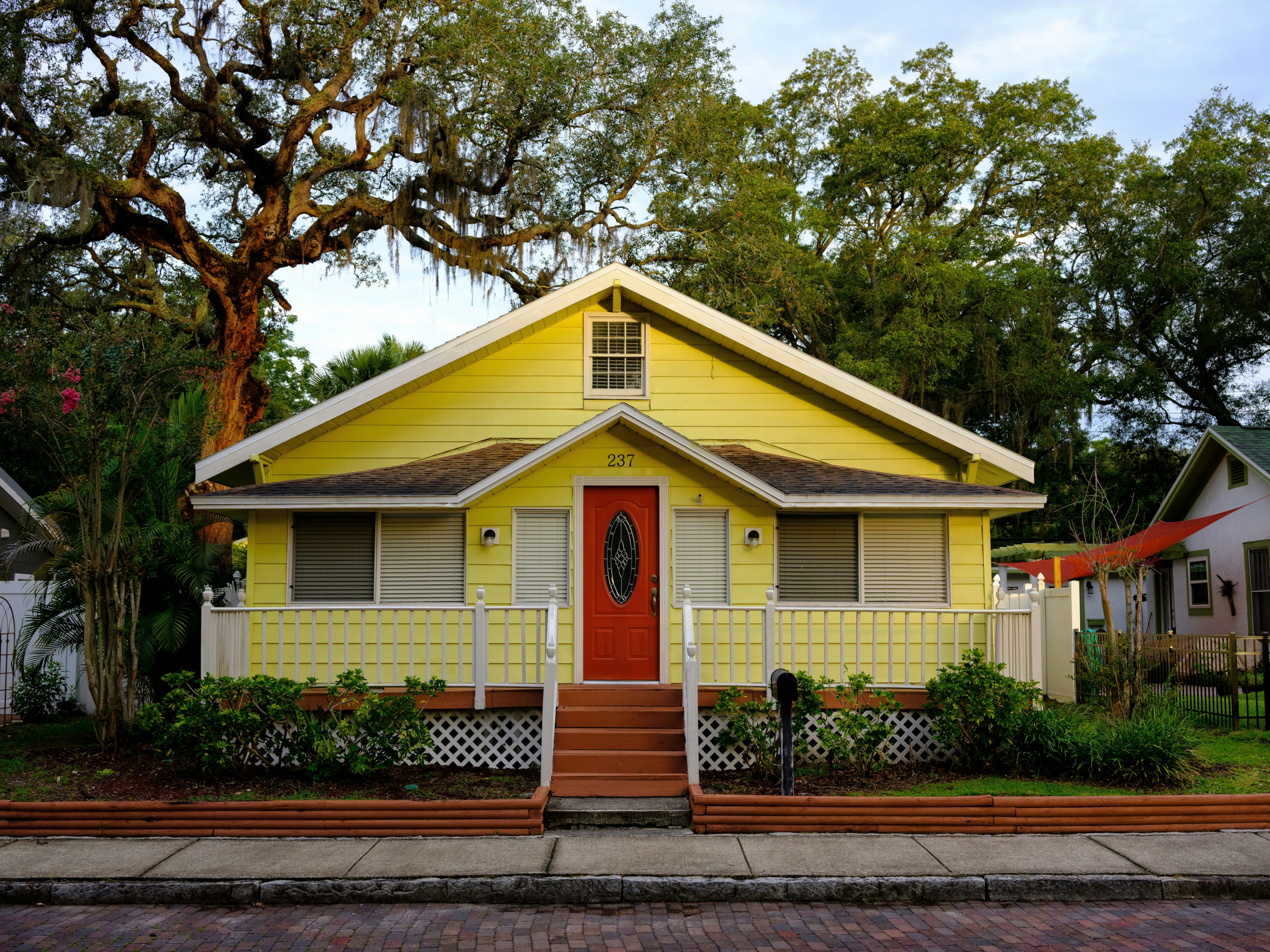 Yellow colored single family house owned by a motivated seller.