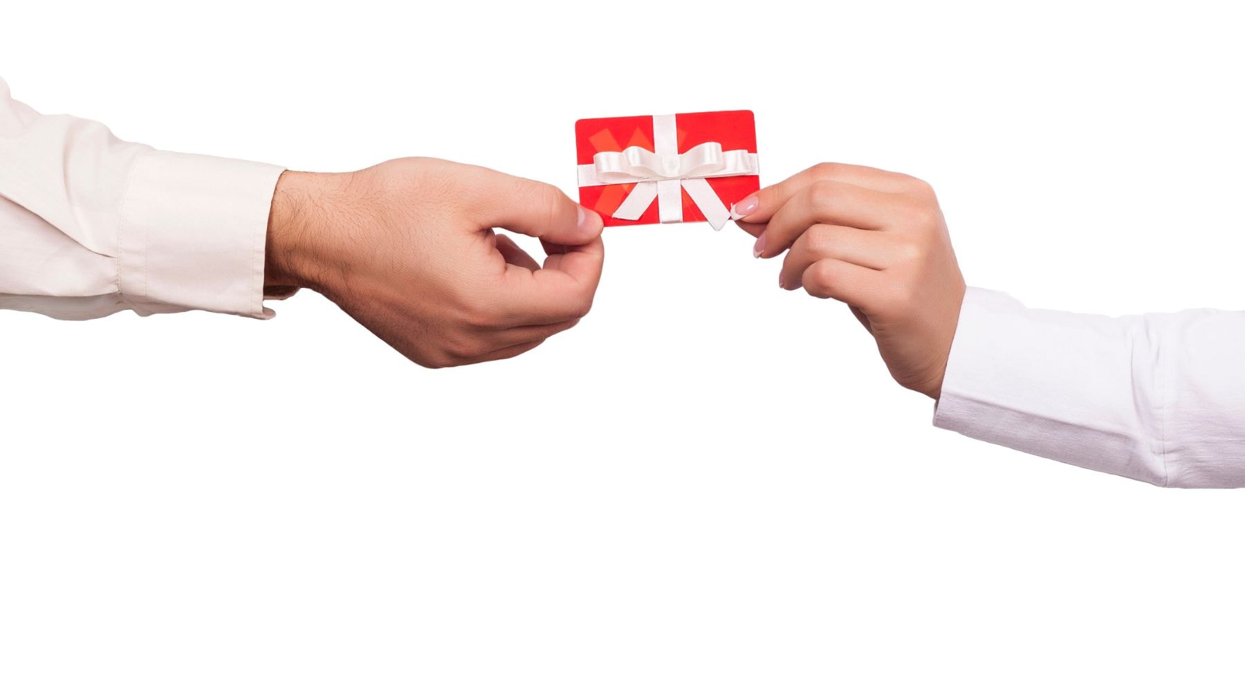 Two hands exchanging a gift card with a red festive bow.